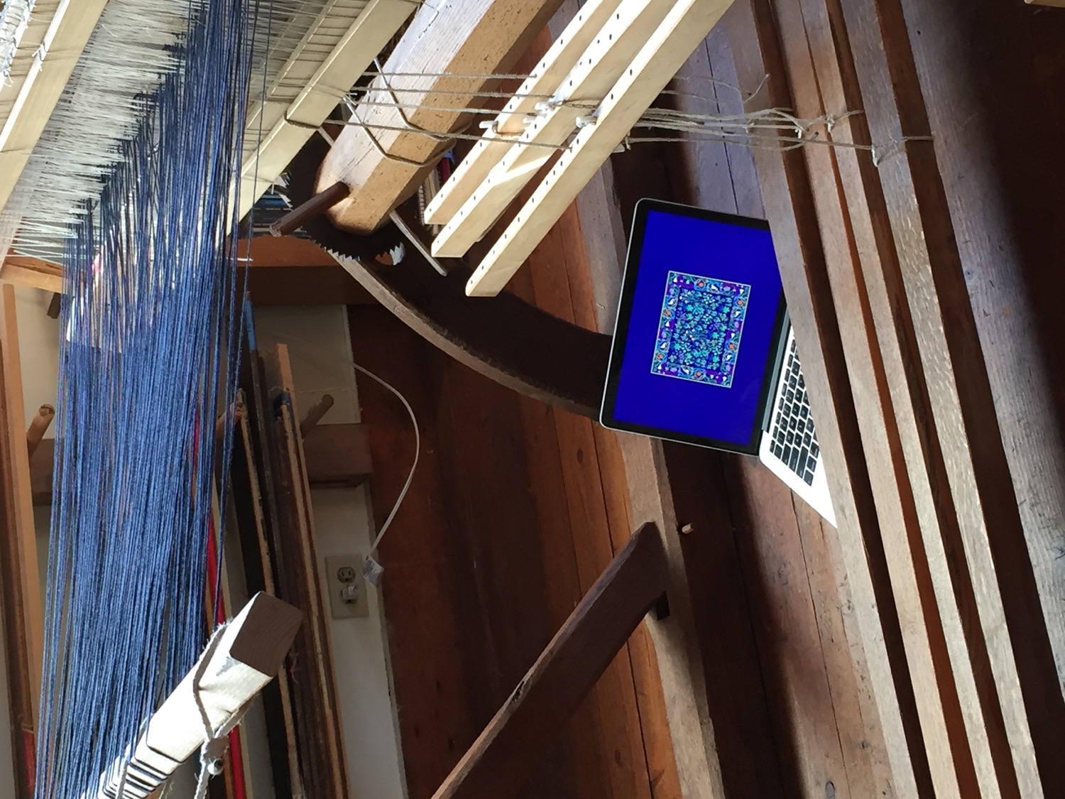 A laptop in a jacquard loom.